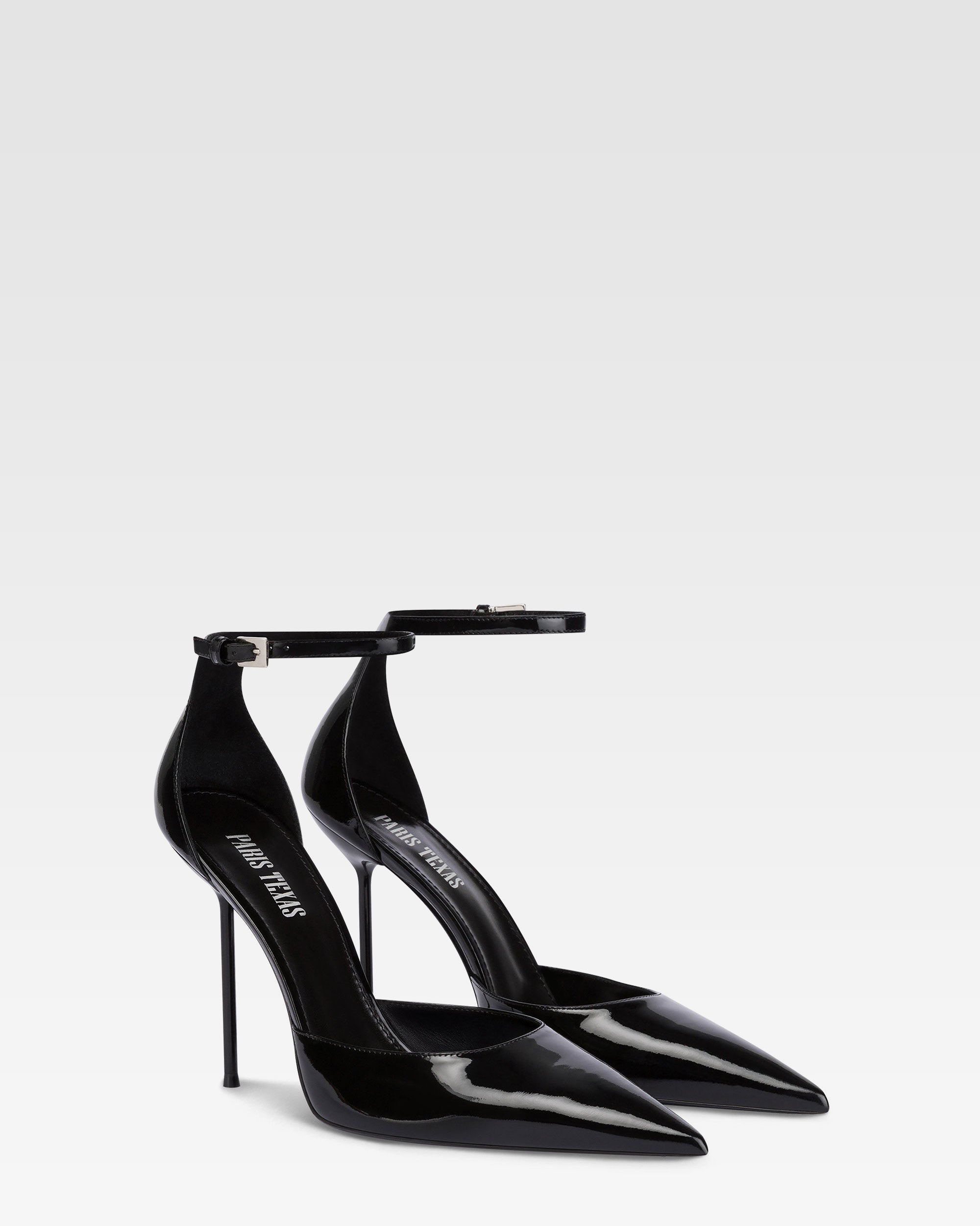 Ankle-strap pumps in black patent leather