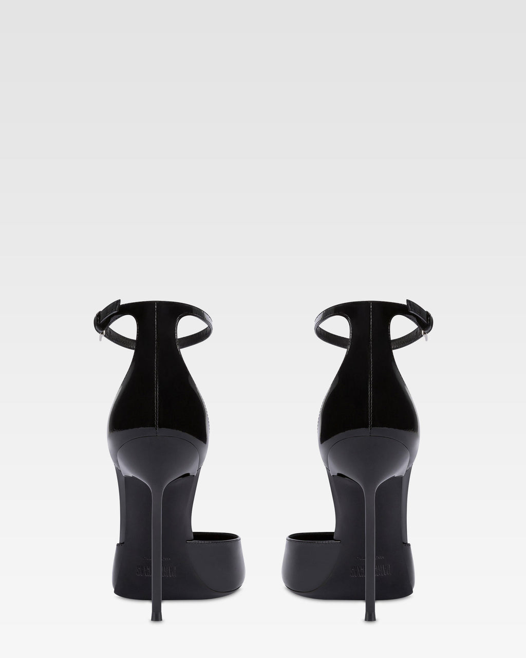 Ankle-strap pumps in black patent leather