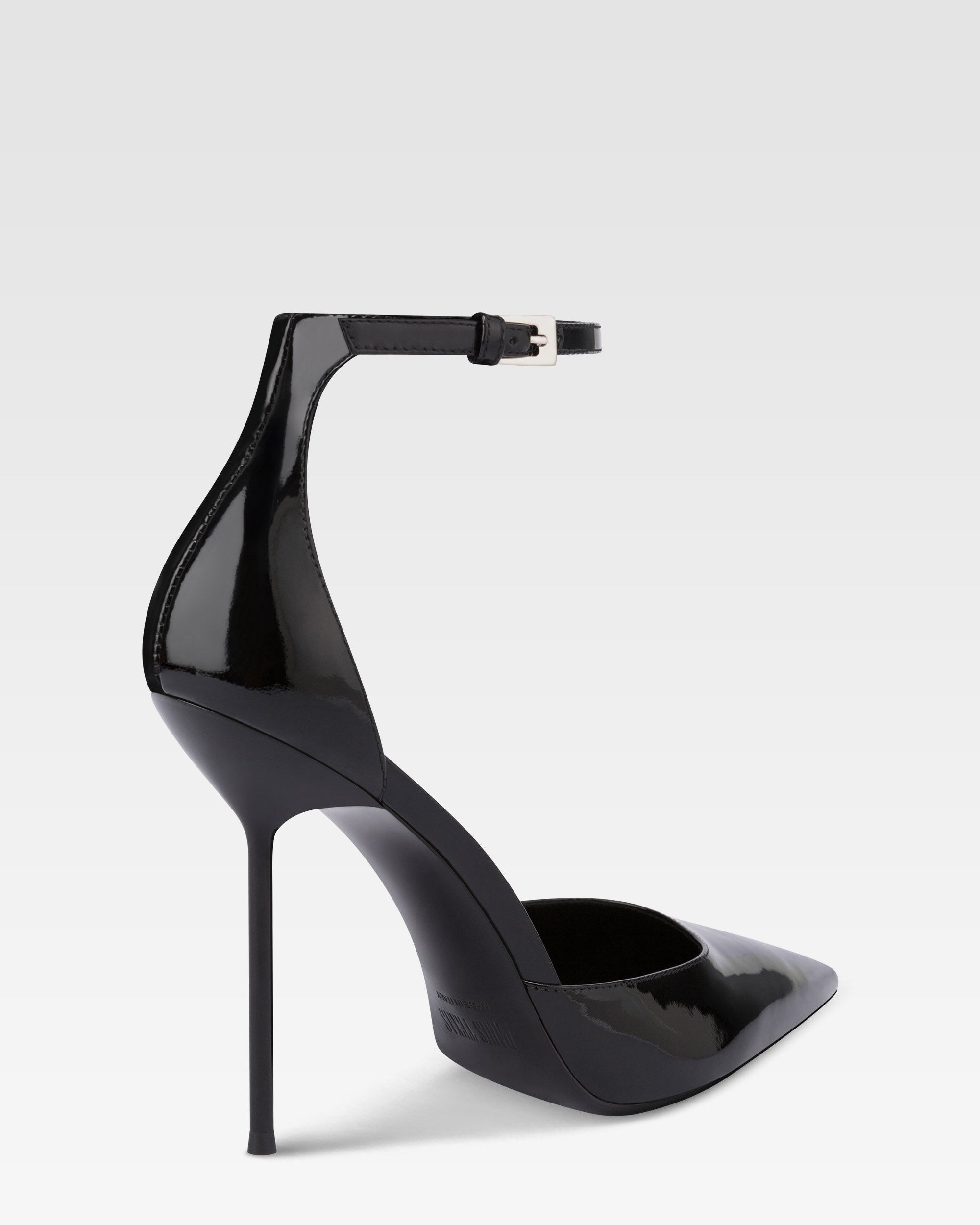 Ankle-strap pumps in black patent leather