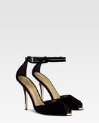 Sandals in black velvet with gold detailing.