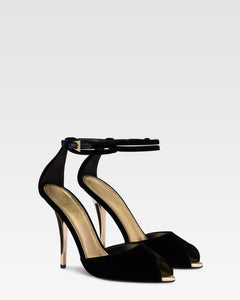Sandals in black velvet with gold detailing.
