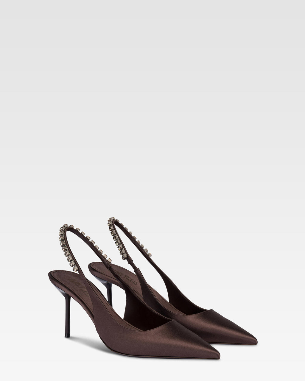 Slingbacks in ebony satin with stud detailing.