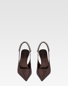 Slingbacks in ebony satin with stud detailing.
