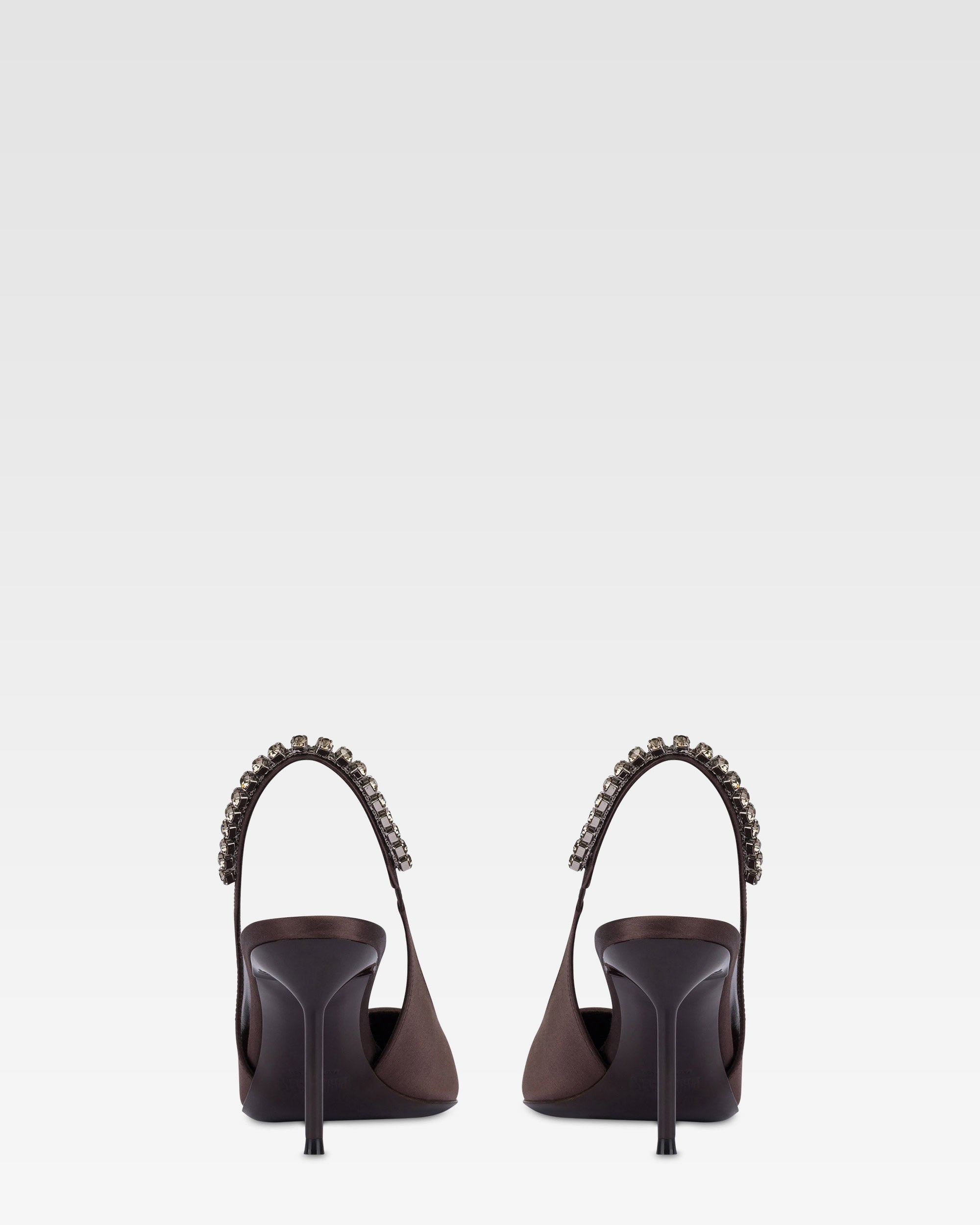 Slingbacks in ebony satin with stud detailing.