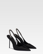 Slingbacks in black satin with stud detailing.