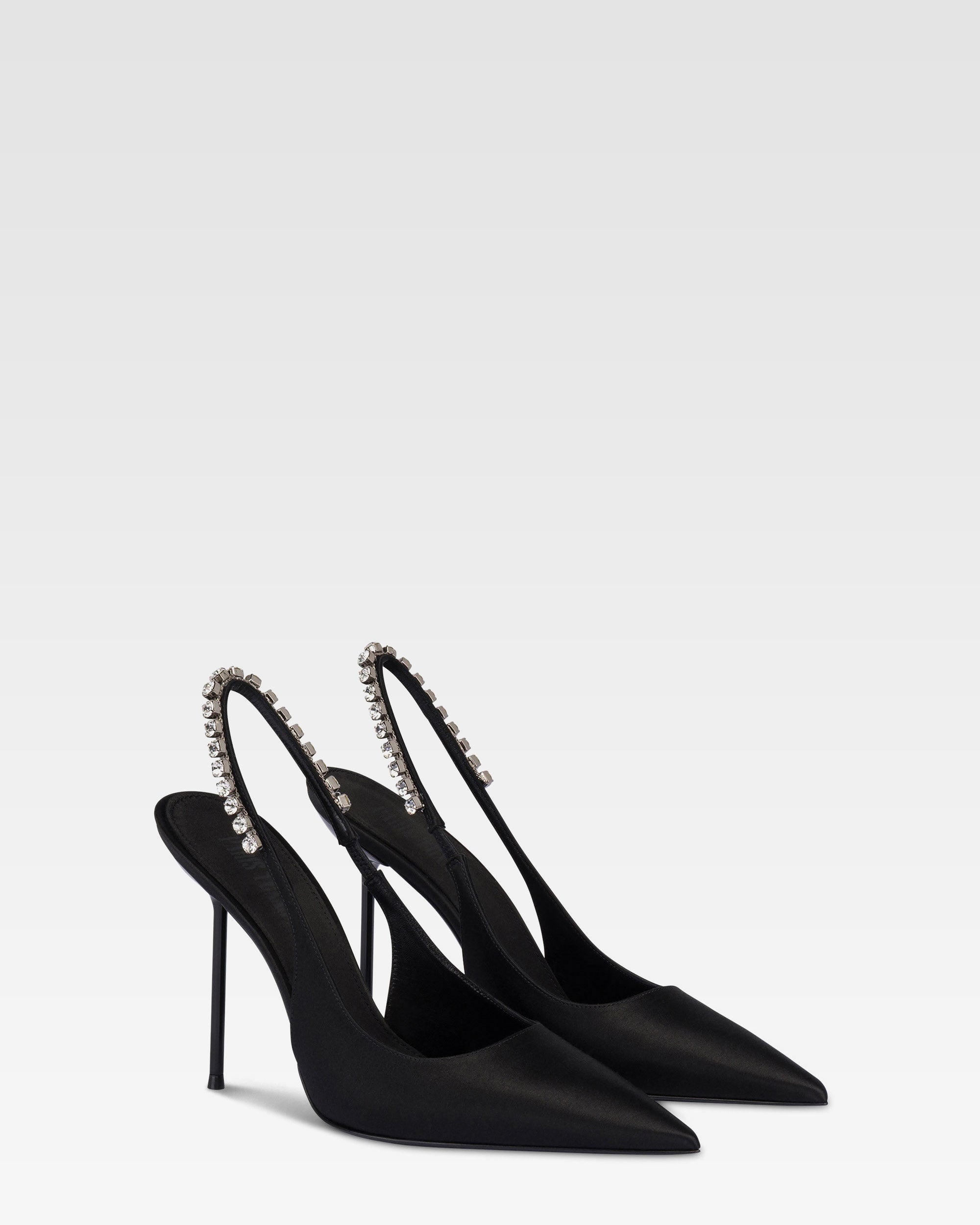 Slingbacks in black satin with stud detailing.