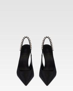 Slingbacks in black satin with stud detailing.