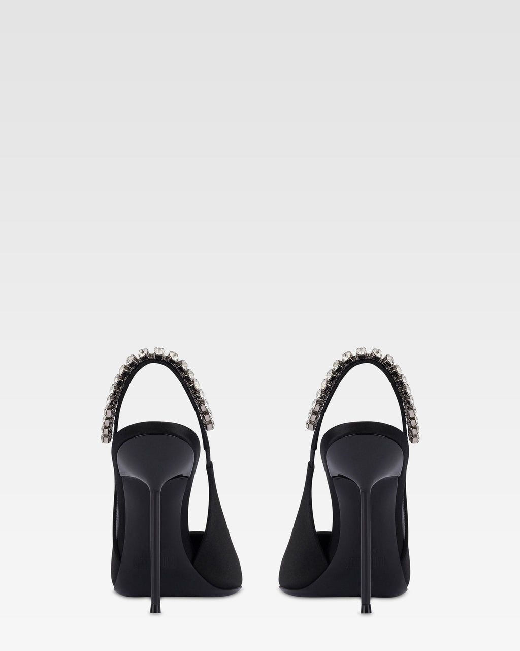 Slingbacks in black satin with stud detailing.
