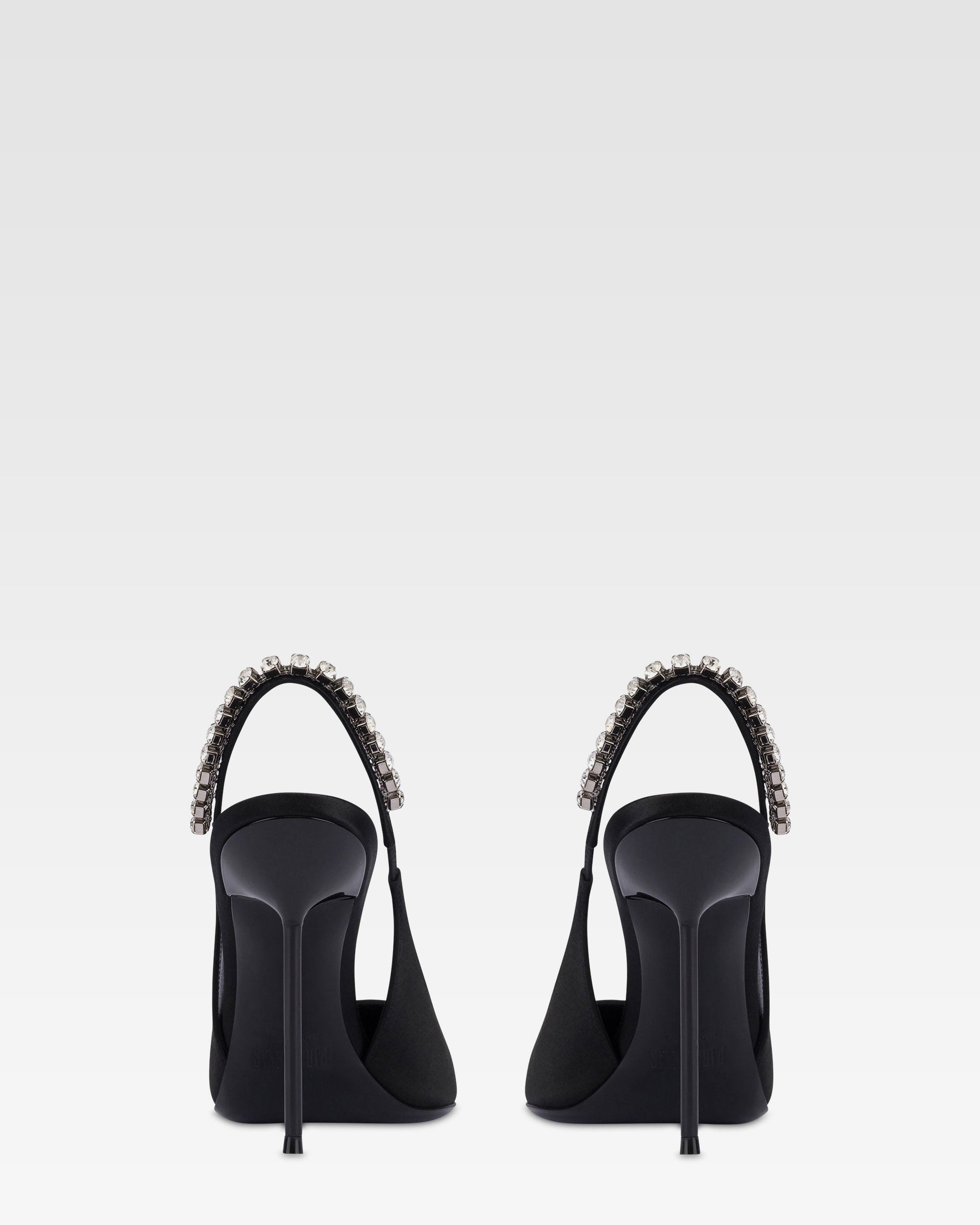 Slingbacks in black satin with stud detailing.