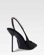 Slingbacks in black satin with stud detailing.