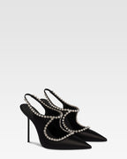 Slingbacks in black satin with stud detailing.