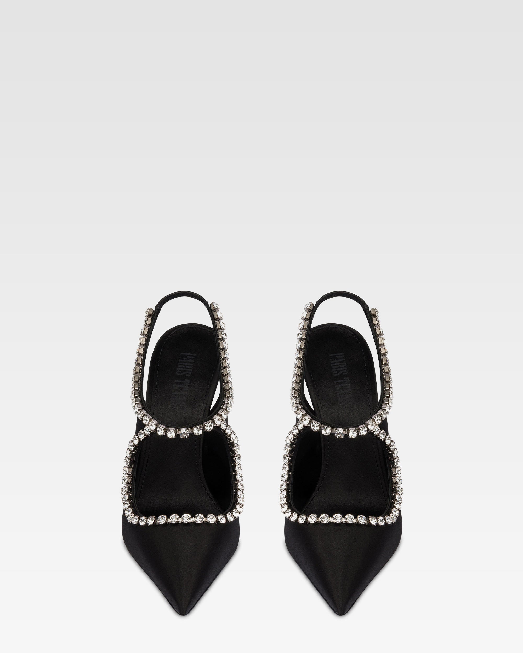 Slingbacks in black satin with stud detailing.
