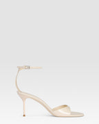 Ankle-strap sandals in ivory patent leather