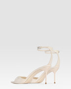 Ankle-strap sandals in ivory patent leather