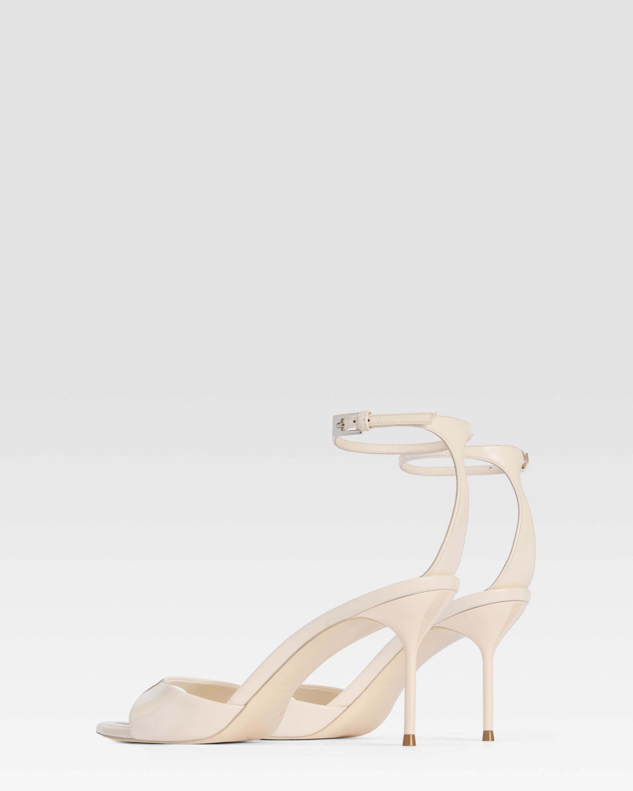 Ankle-strap sandals in ivory patent leather