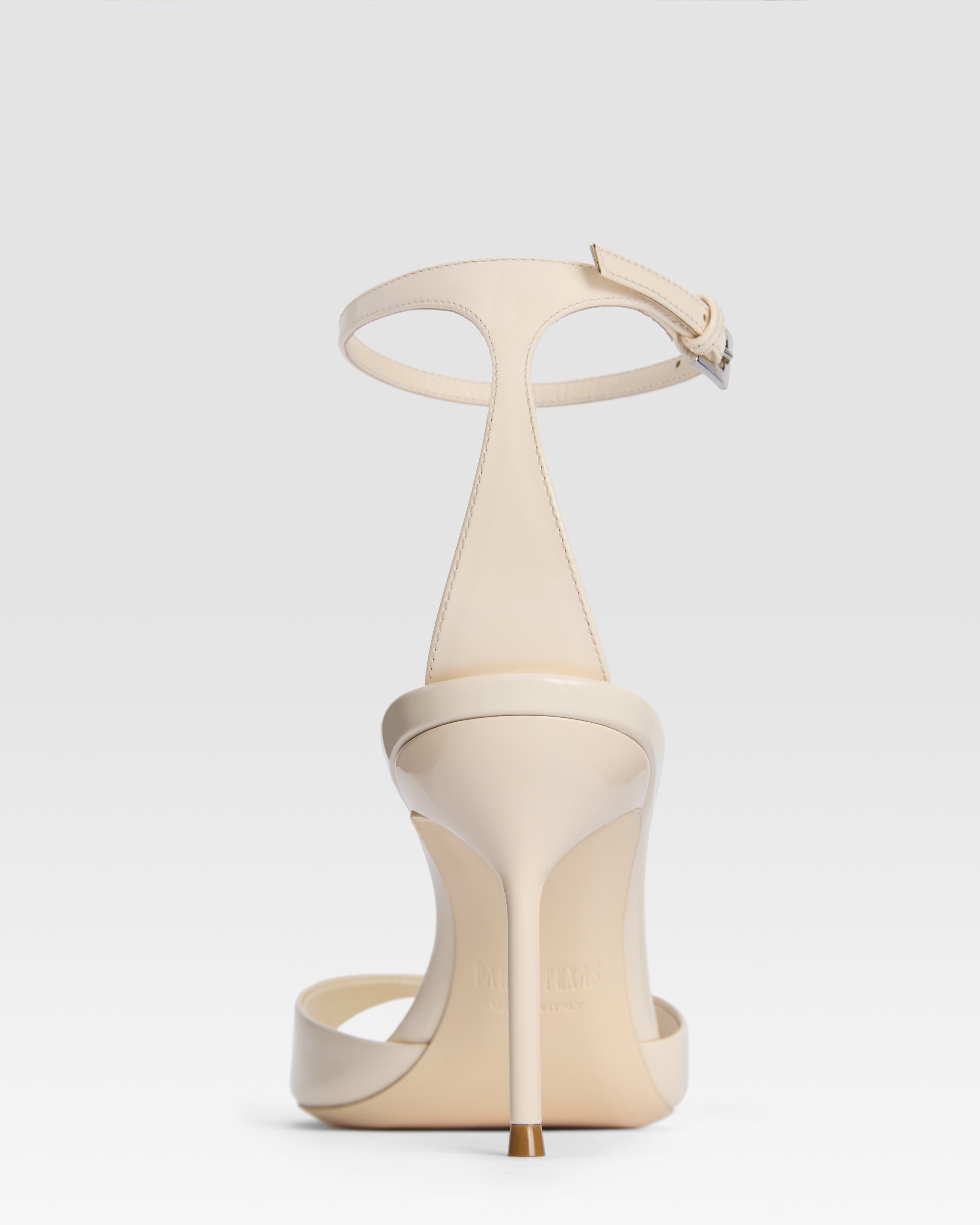 Ankle-strap sandals in ivory patent leather
