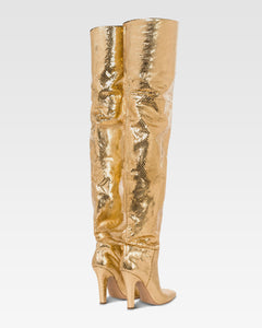 Over-the-knee boots in gold, metallic-effect printed python leather.