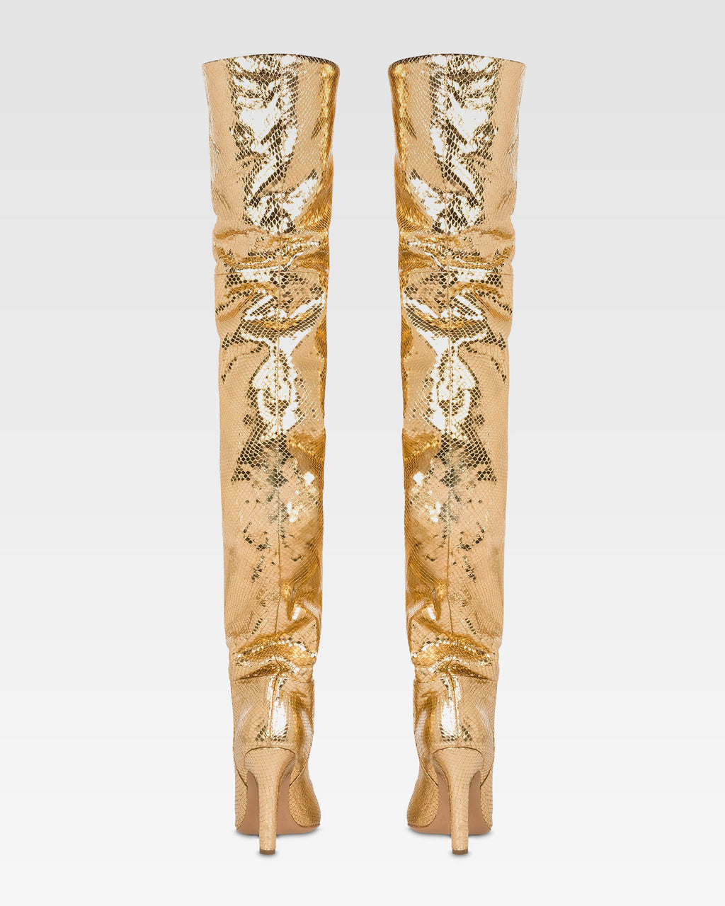 Over-the-knee boots in gold, metallic-effect printed python leather.