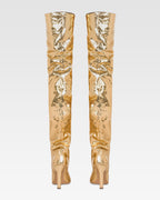 Over-the-knee boots in gold, metallic-effect printed python leather.
