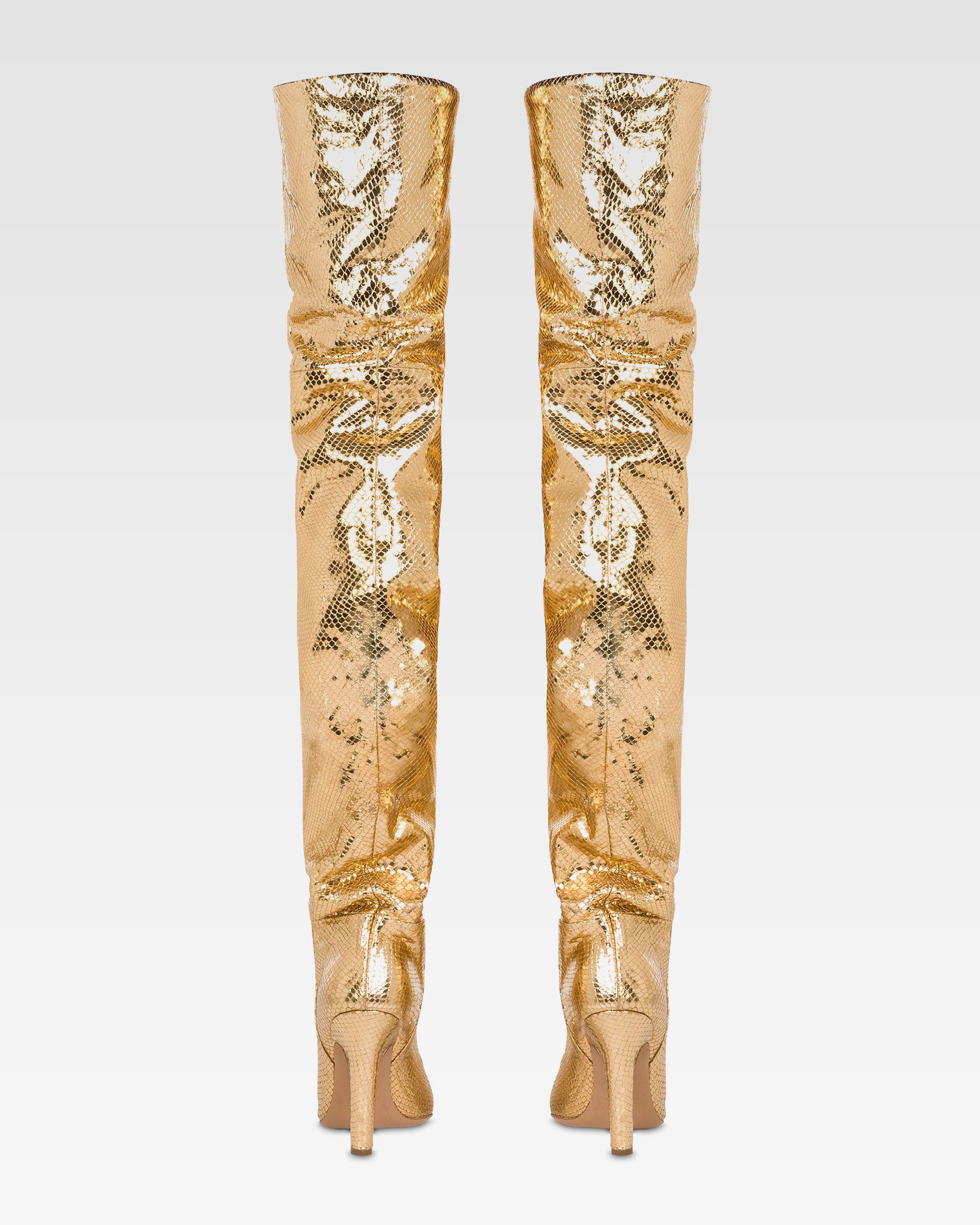 Over-the-knee boots in gold, metallic-effect printed python leather.