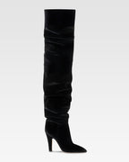 Over-the-knee boots in black velvet.