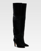 Over-the-knee boots in black velvet.