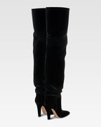 Over-the-knee boots in black velvet.
