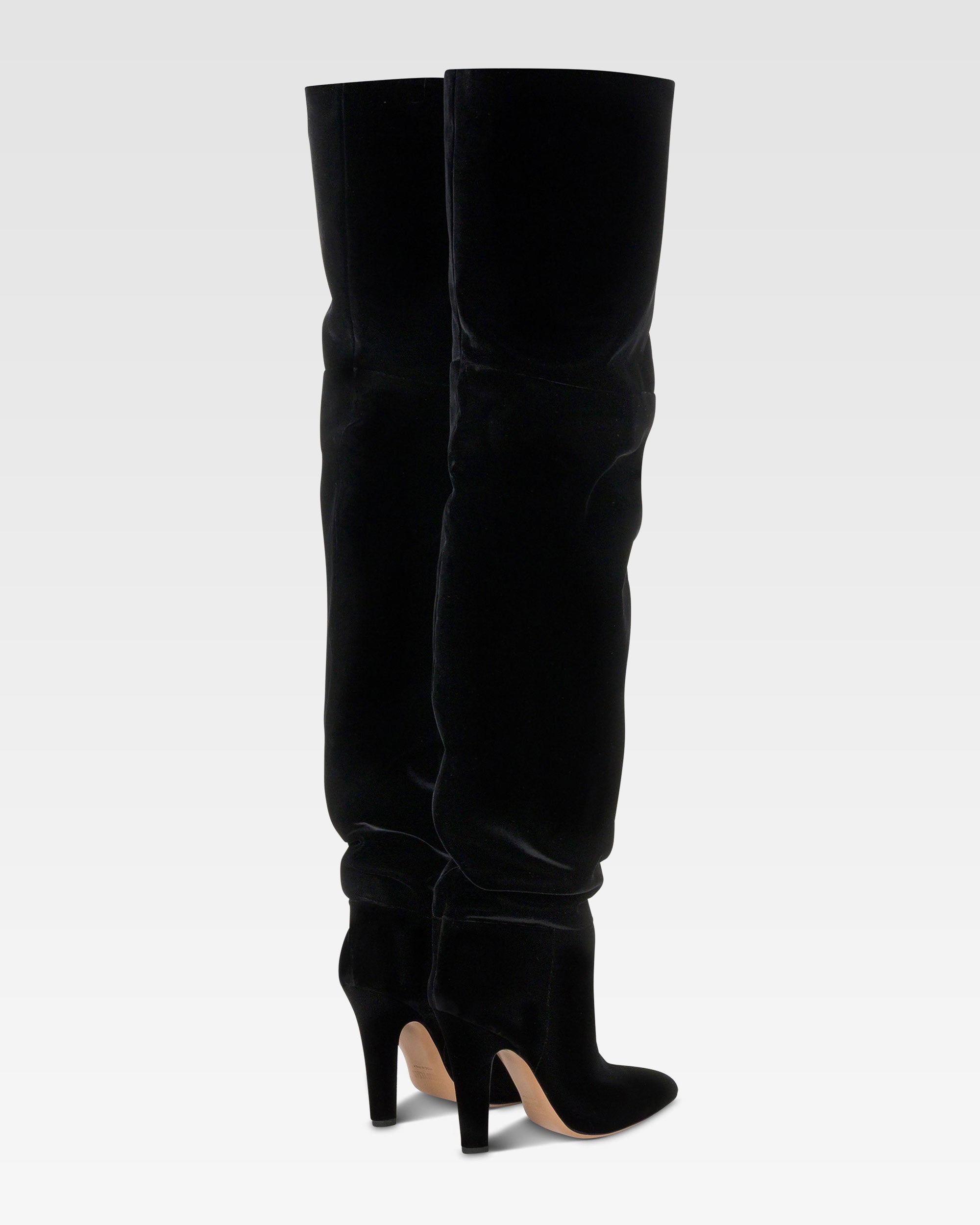 Over-the-knee boots in black velvet.