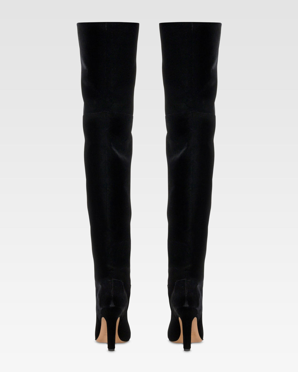 Over-the-knee boots in black velvet.