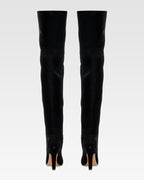 Over-the-knee boots in black velvet.