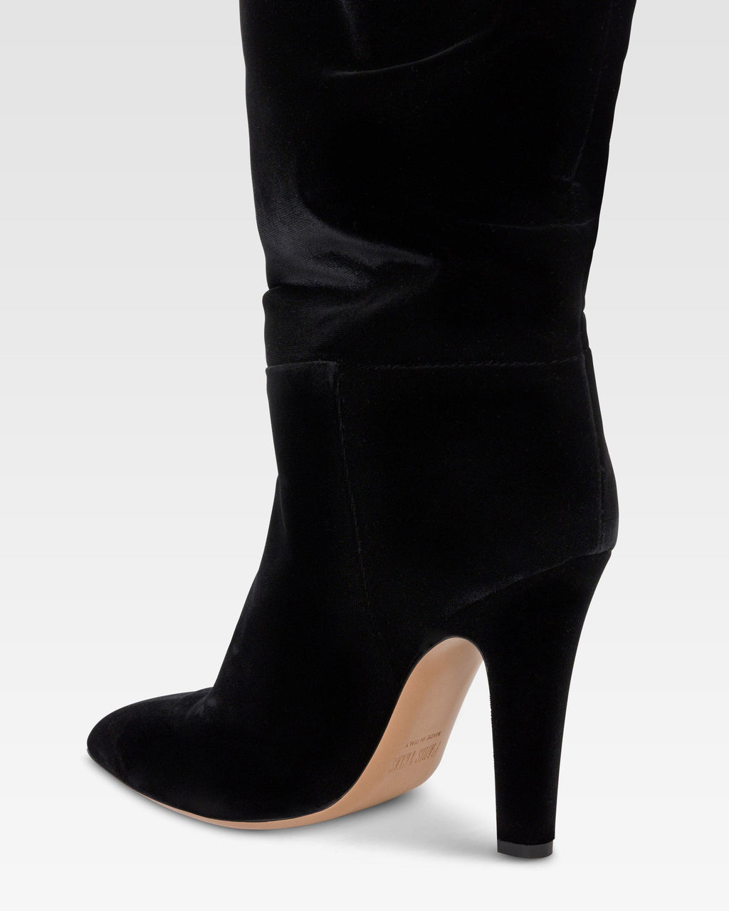 Over-the-knee boots in black velvet.