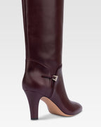 Boots in pinot noir calf leather.