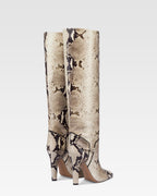 Boots in natural printed python leather.
