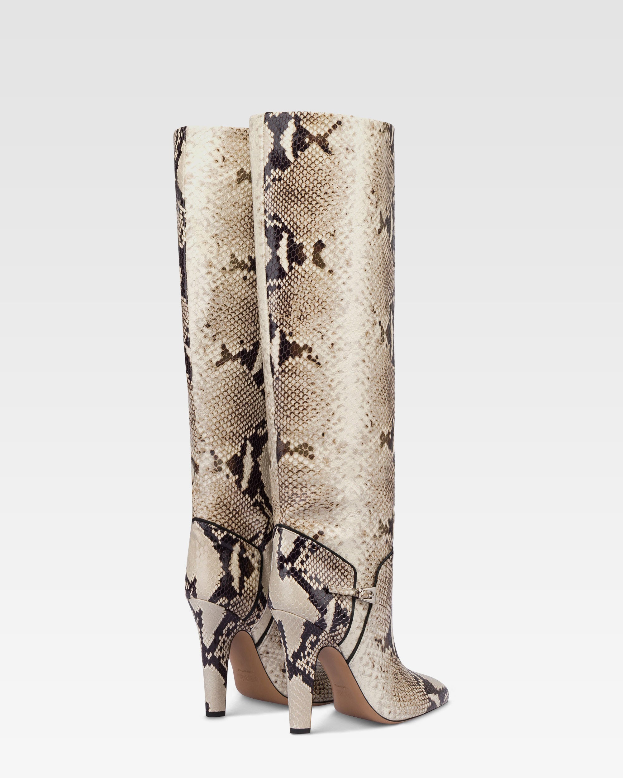 Boots in natural printed python leather.