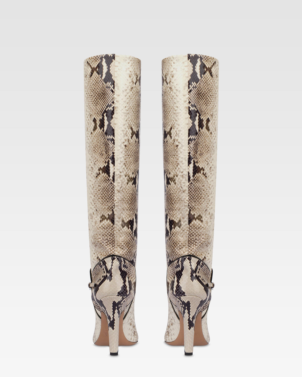 Boots in natural printed python leather.