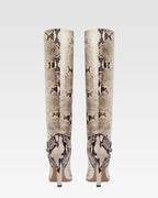 Boots in natural printed python leather.