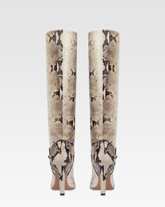 Boots in natural printed python leather.