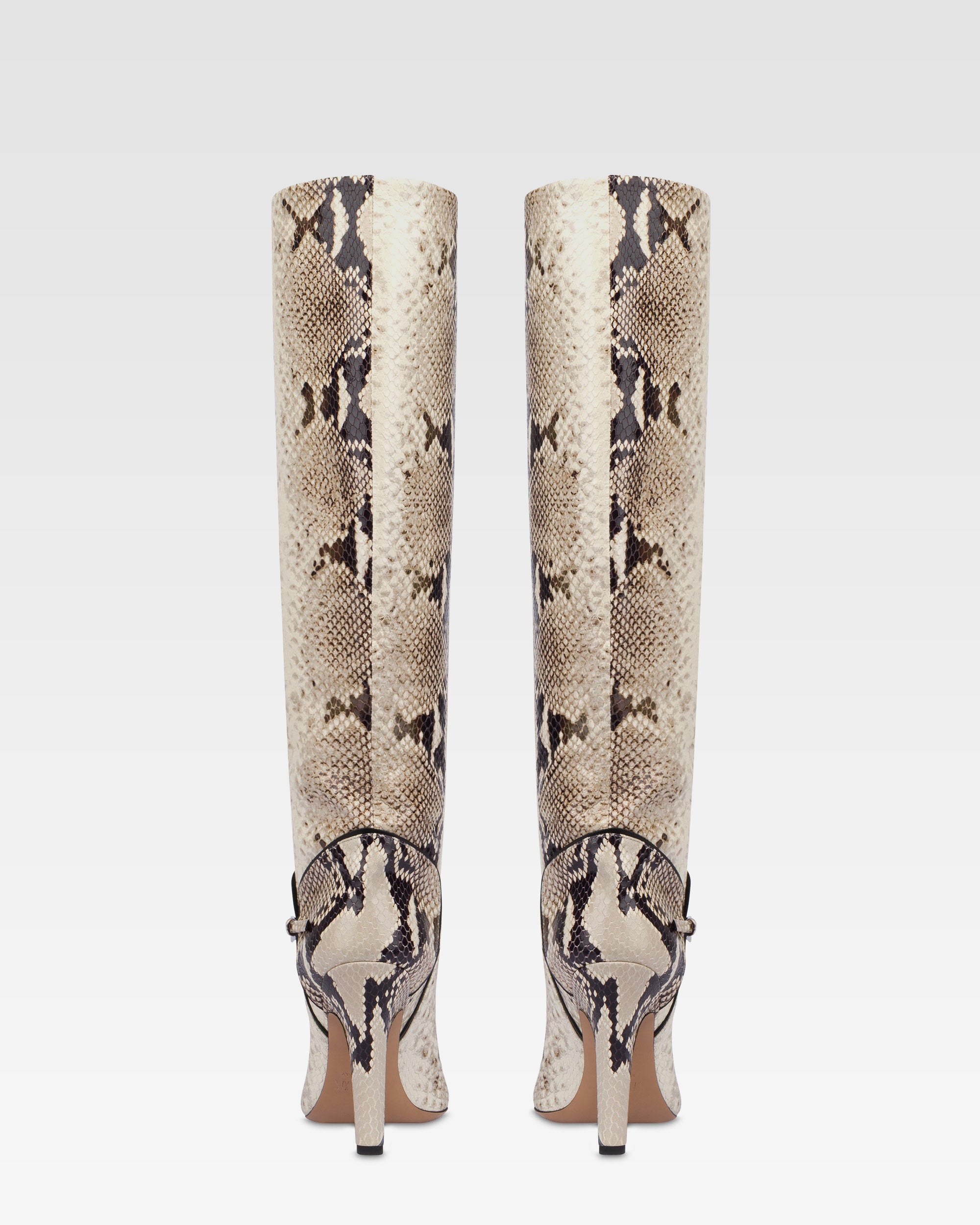 Boots in natural printed python leather.