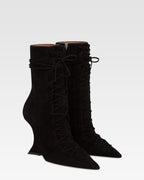 Ankle boots in black calf suede leather.