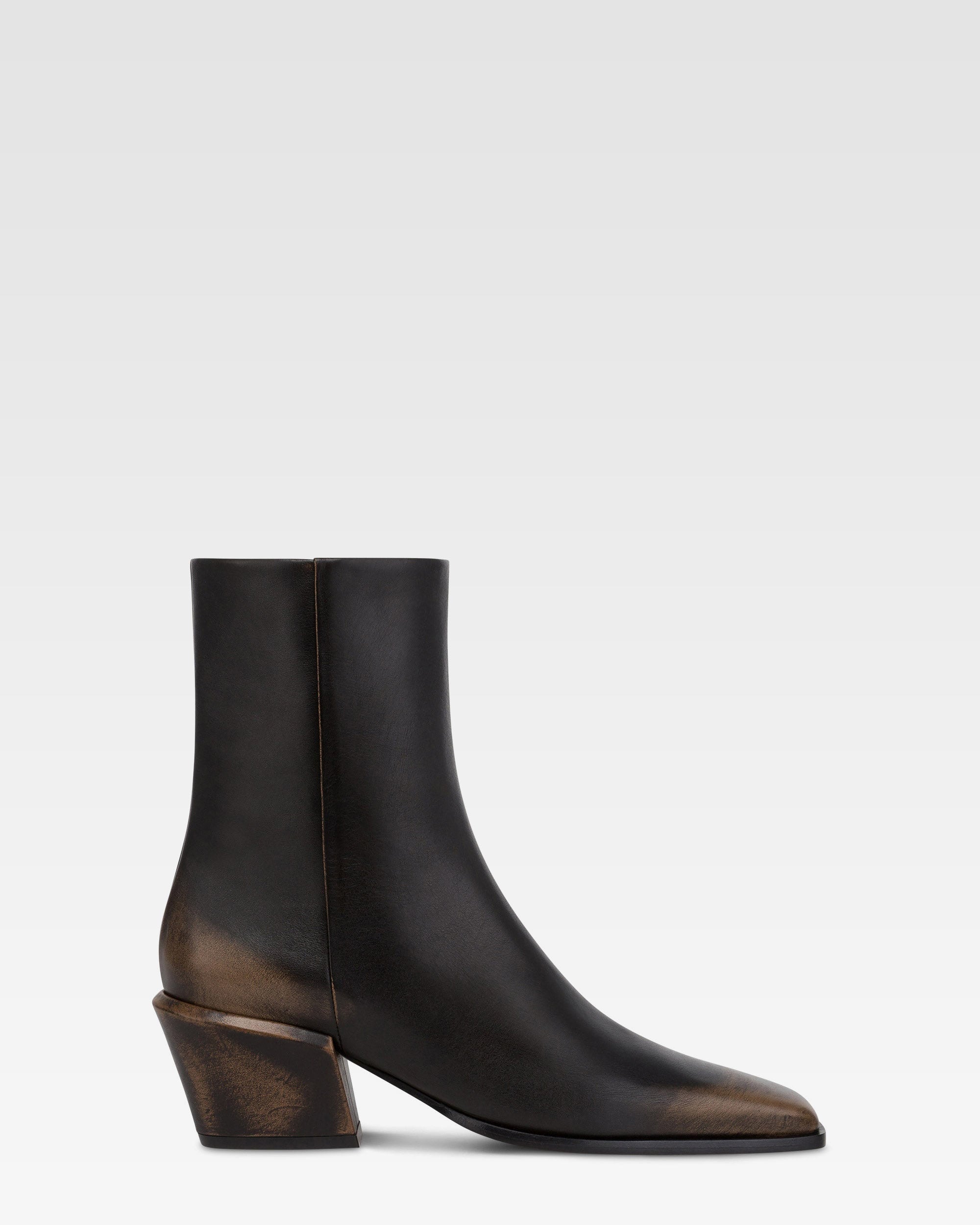 Ankle boots in black brushed leather.