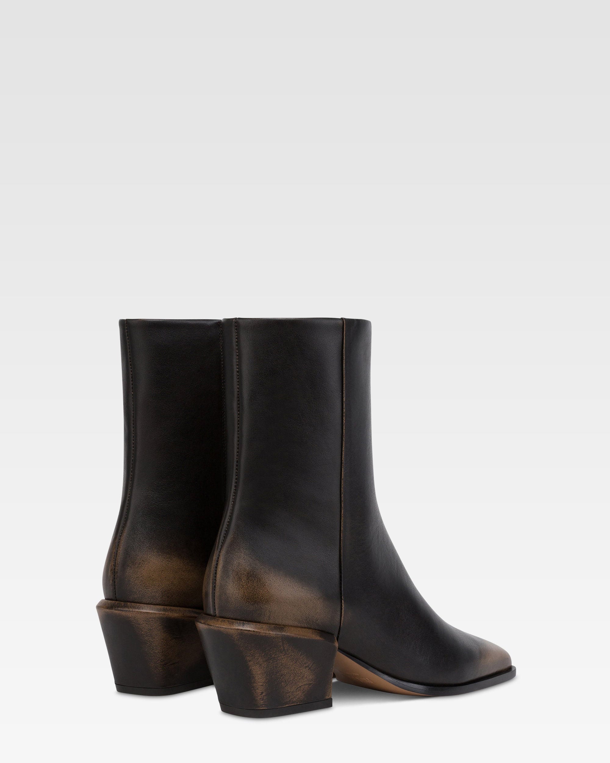 Ankle boots in black brushed leather.