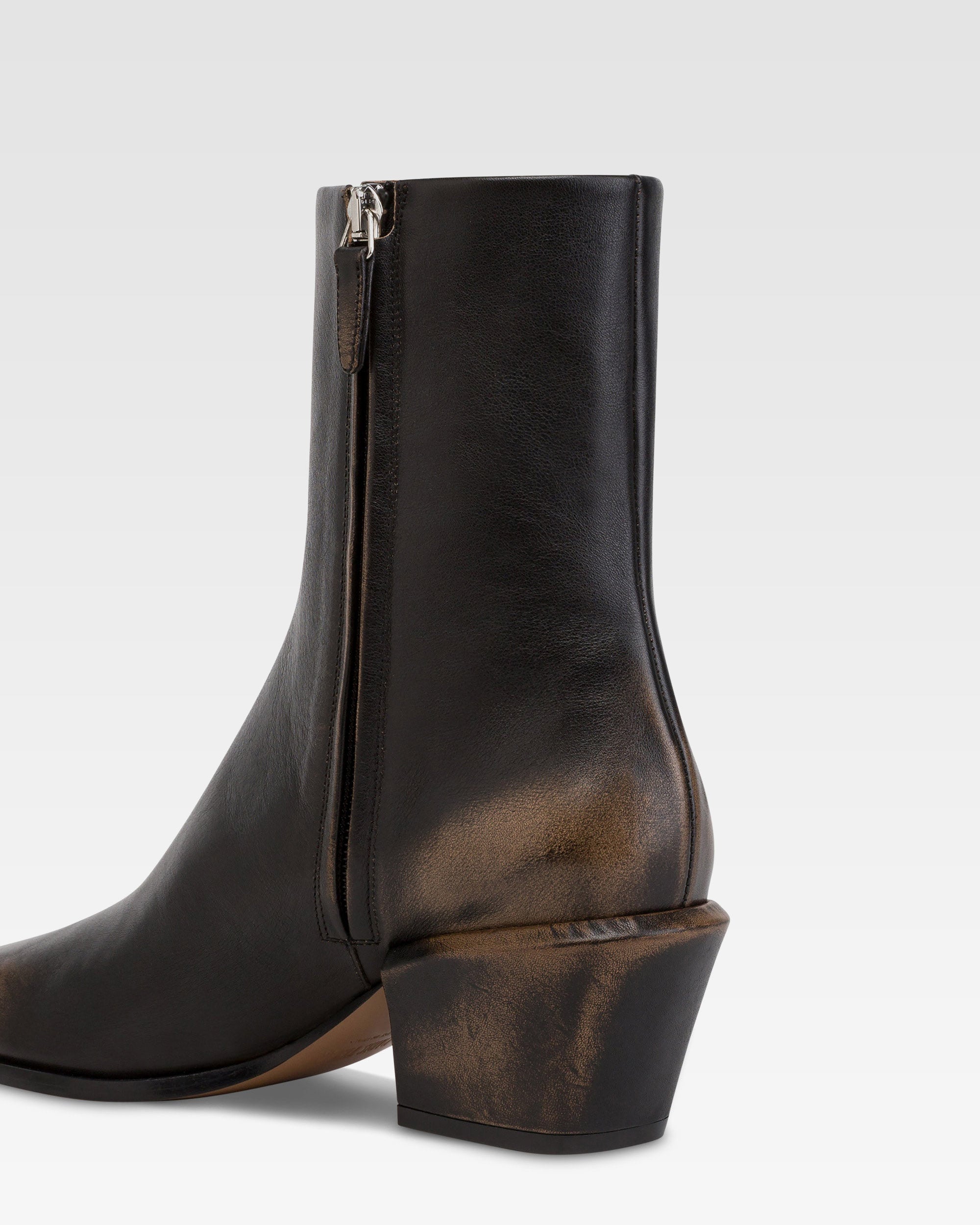 Ankle boots in black brushed leather.