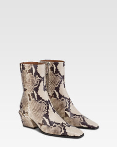 Ankle boots in natural printed python leather.