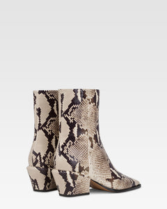 Ankle boots in natural printed python leather.