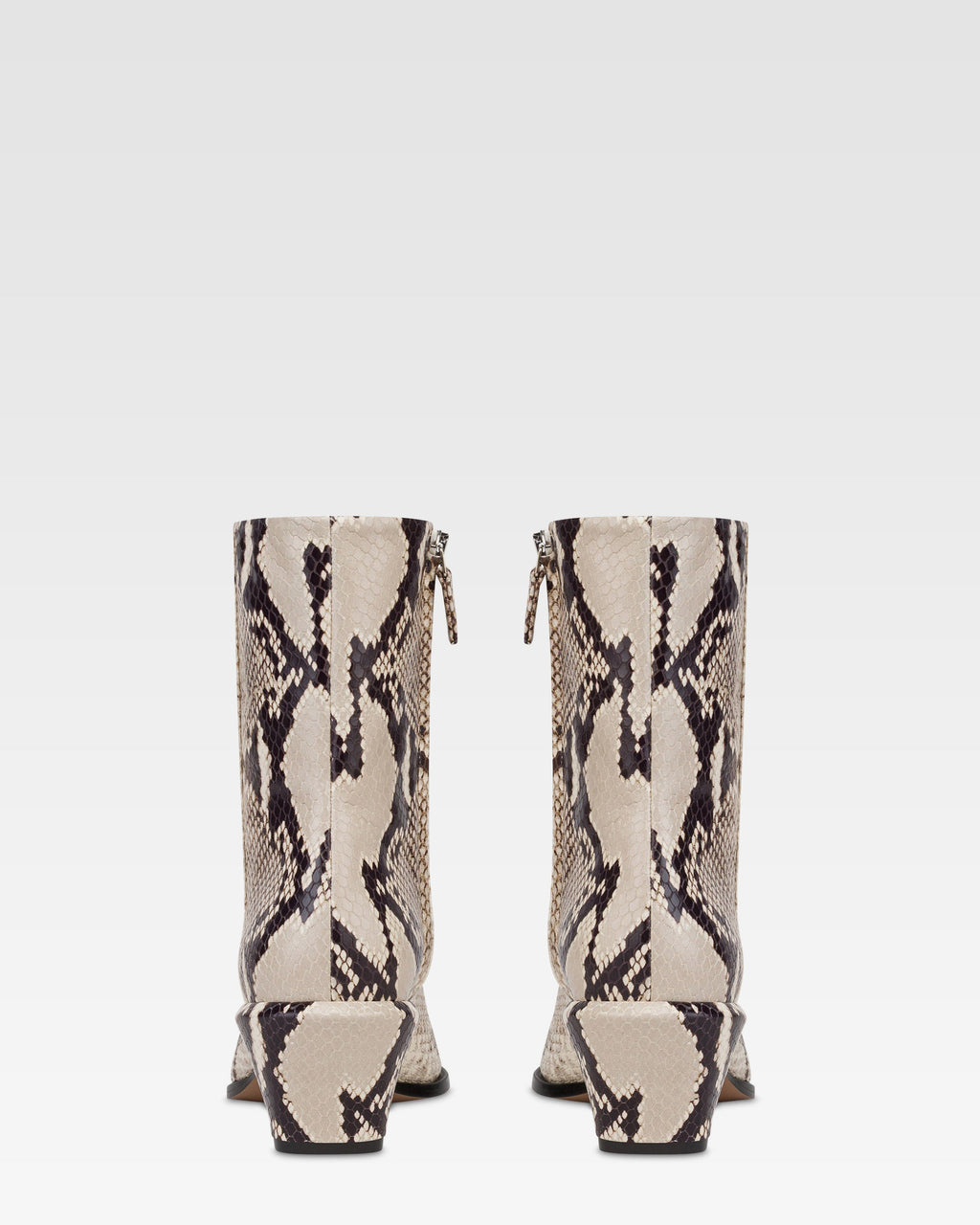 Ankle boots in natural printed python leather.