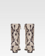 Ankle boots in natural printed python leather.