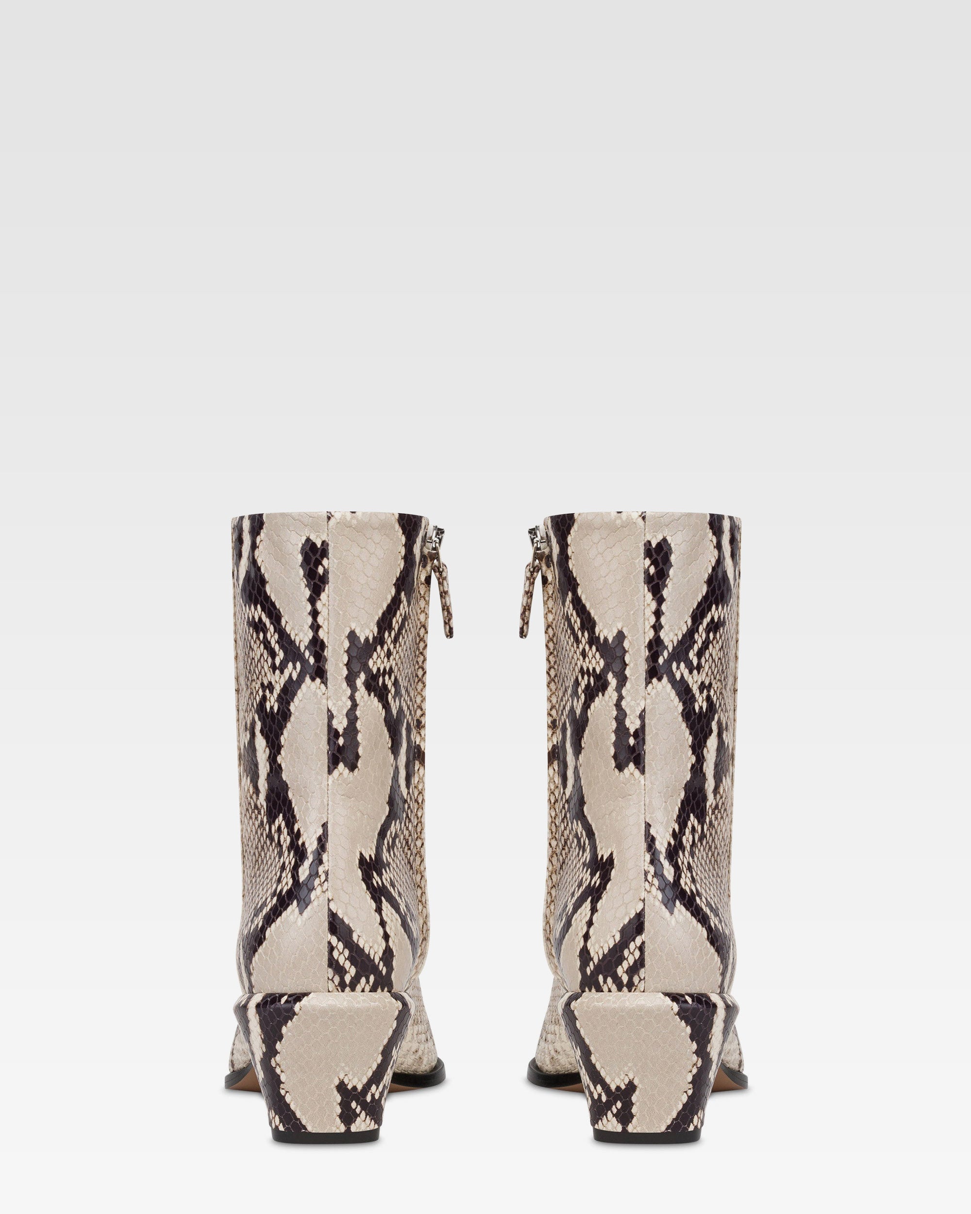 Ankle boots in natural printed python leather.