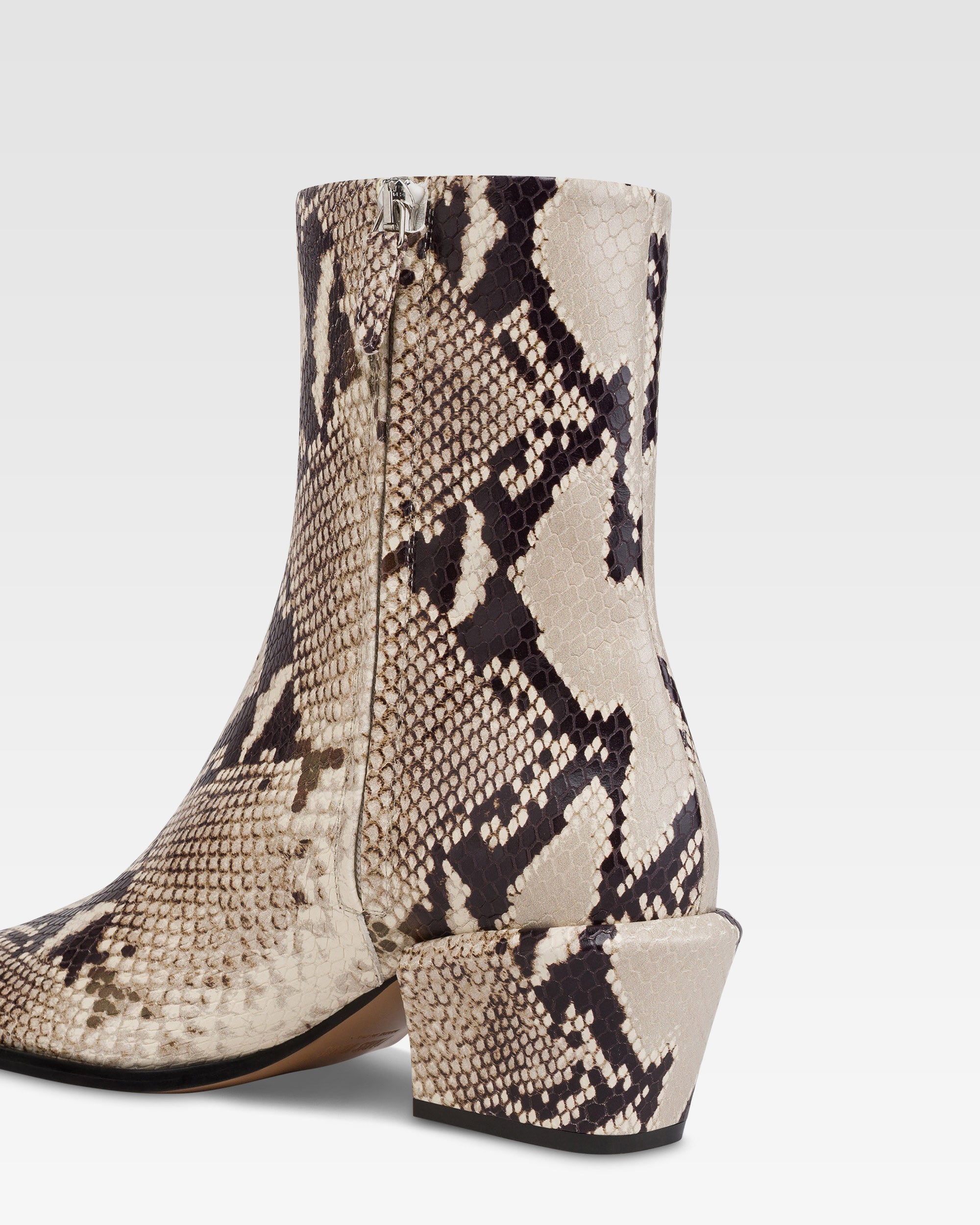 Ankle boots in natural printed python leather.