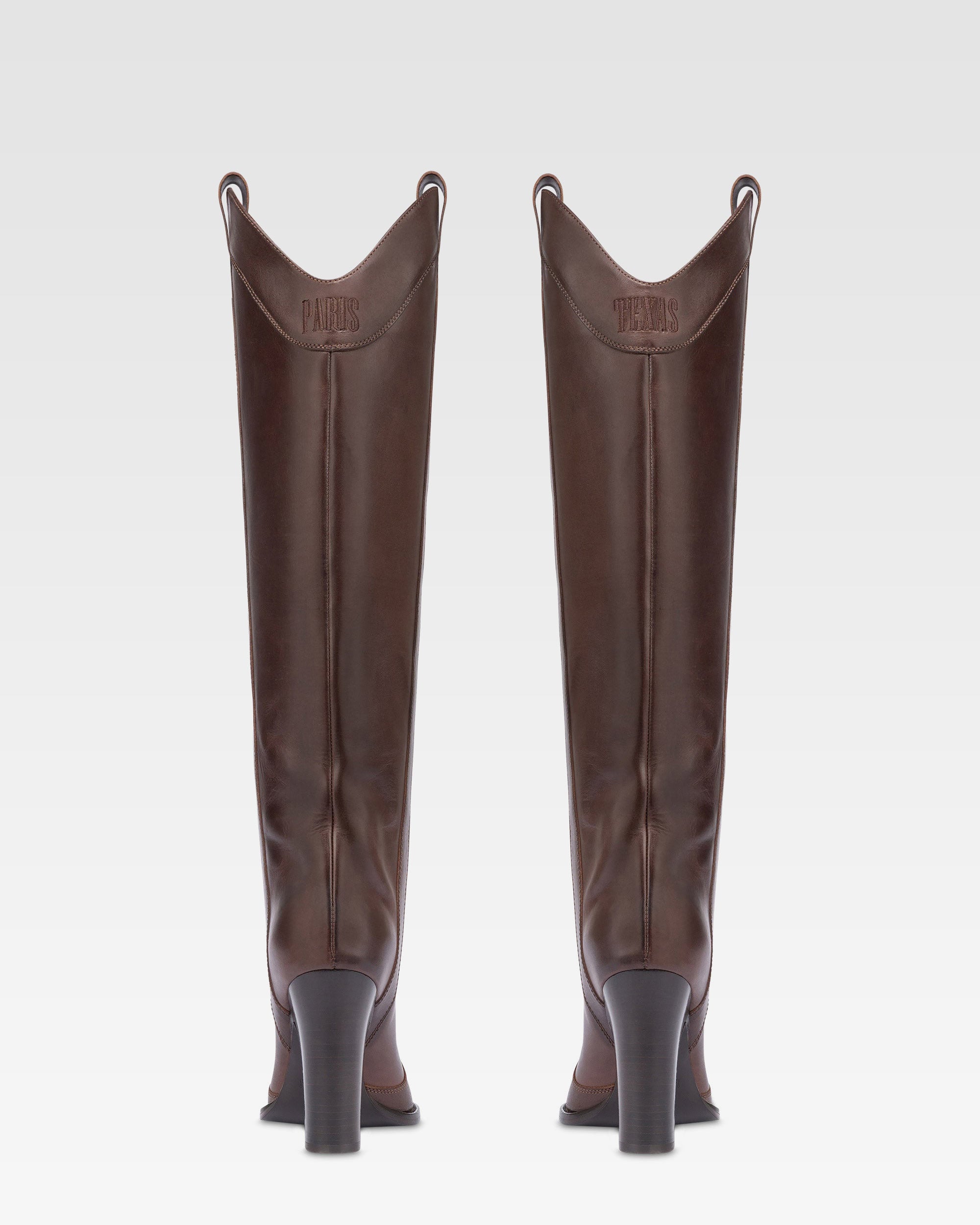 Boots in ebony calf leather.