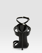 Sandals in black patent leather